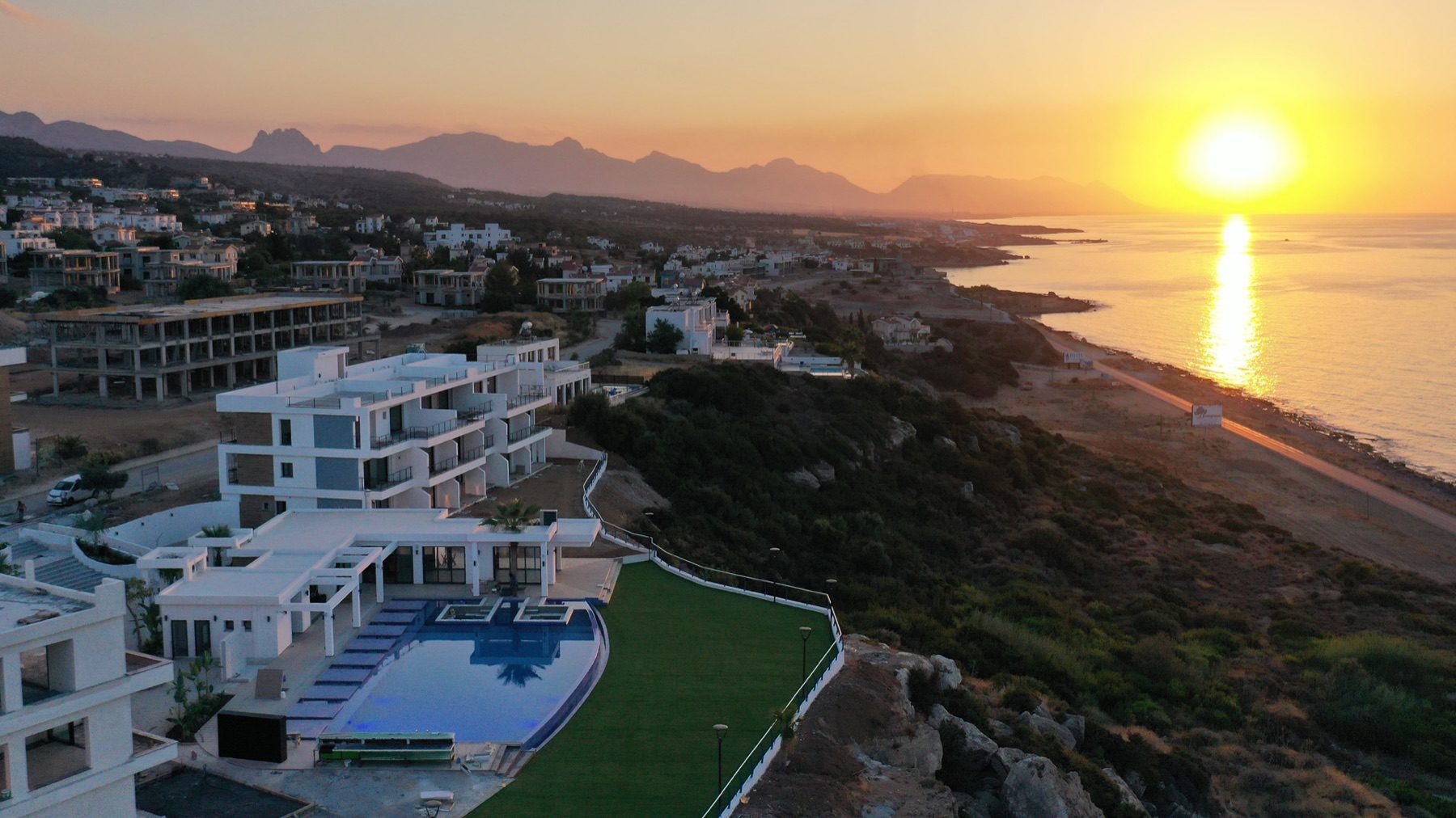Aerial view of villas with a pool above the sea, Northern Cyprus