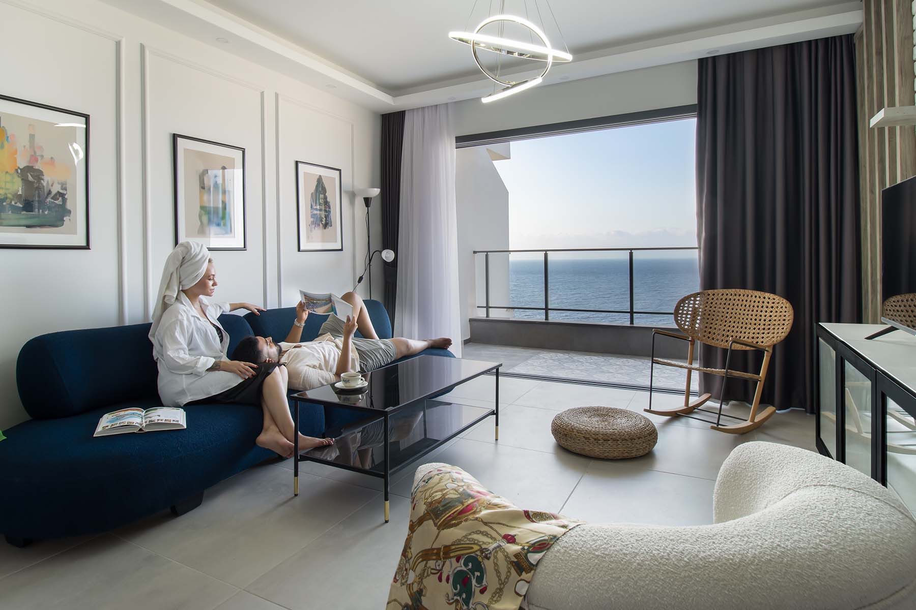 Caesar Cliff apartment living room with sea-view balcony
