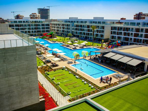 Courtyard Long Beach completed complex with pool and lawns seen from above