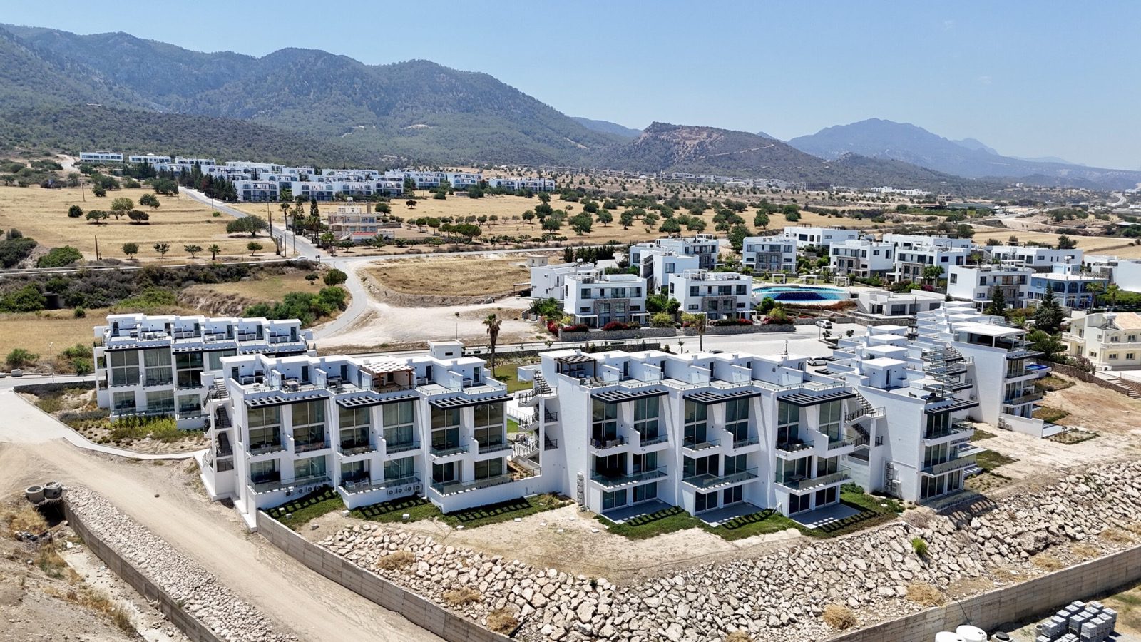 Aerial photo: apartment blocks with the mountain range behind