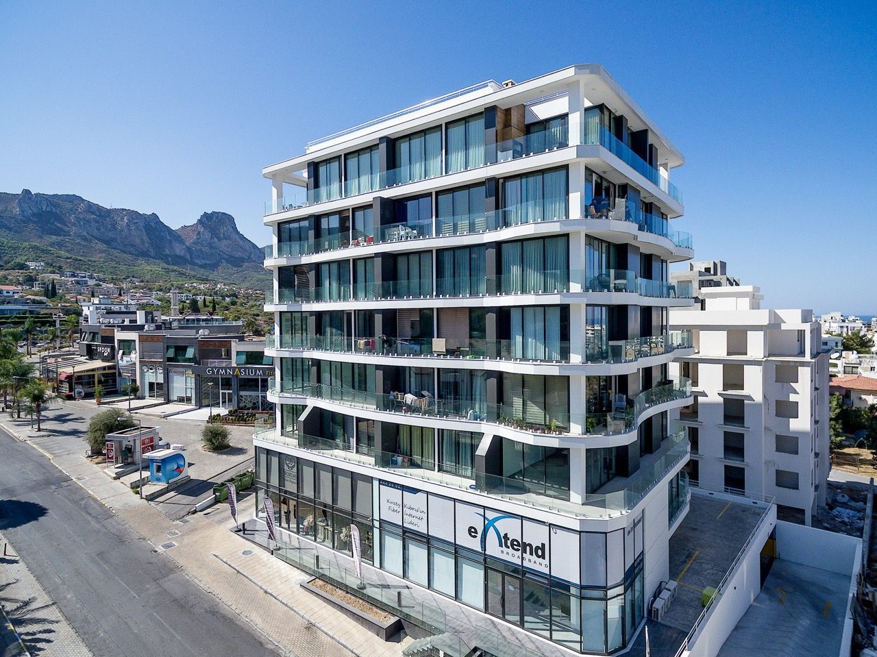 Carrington 22 apartment block seen from the street with mountains behind