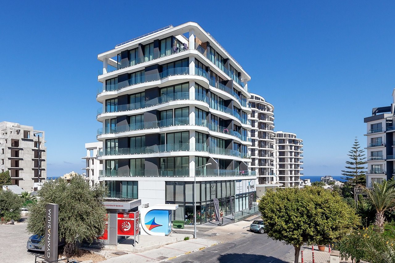 Carrington 22 block with glazed balconies and neighbouring buildings
