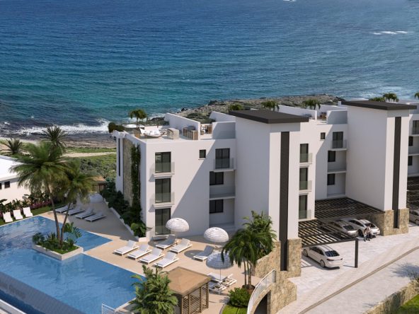 Render: white apartment blocks and a pool terrace above the sea
