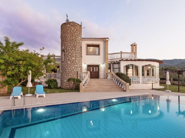 Villa with a round stone tower, terrace and private swimming pool