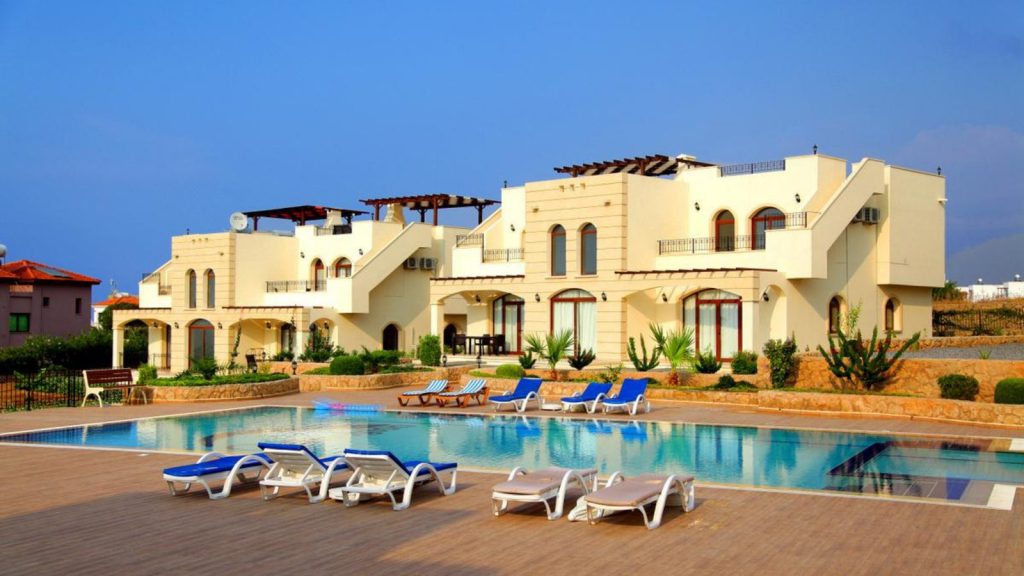 The Residence Esentepe loft apartment blocks beside the communal swimming pool