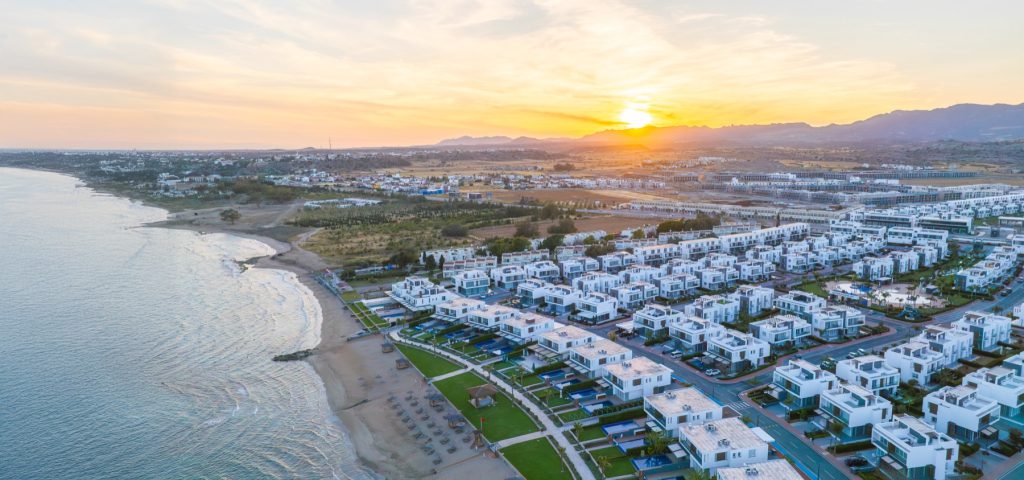 Four Seasons Life aerial view of the beach and housing at sunset