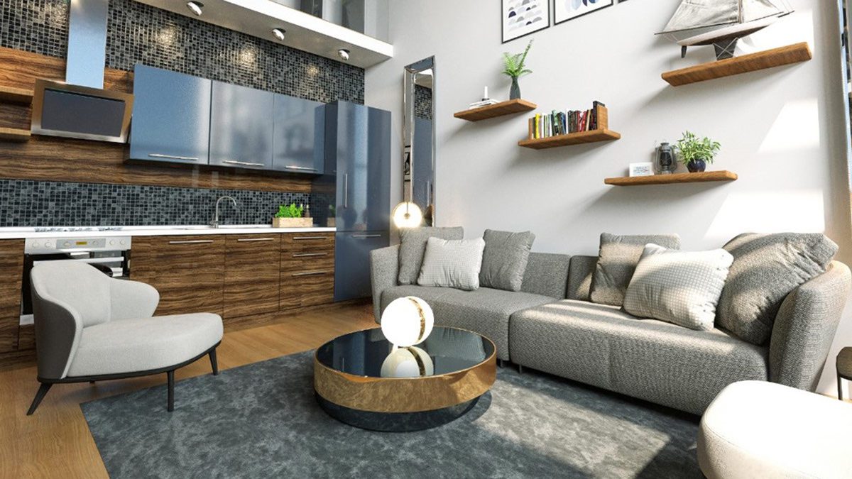 Idyll Homes living room with grey sofa and wood kitchen