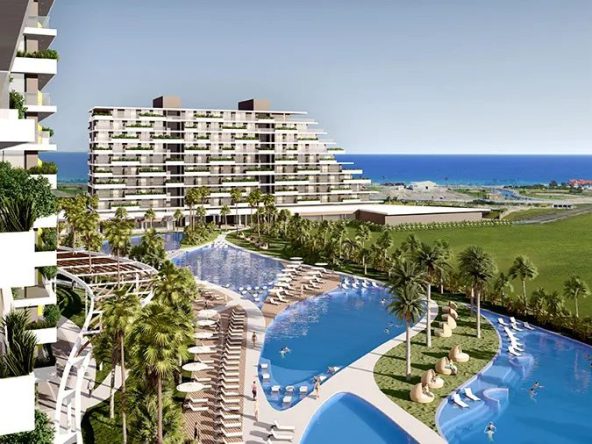 Render of a pool and apartment blocks facing the sea