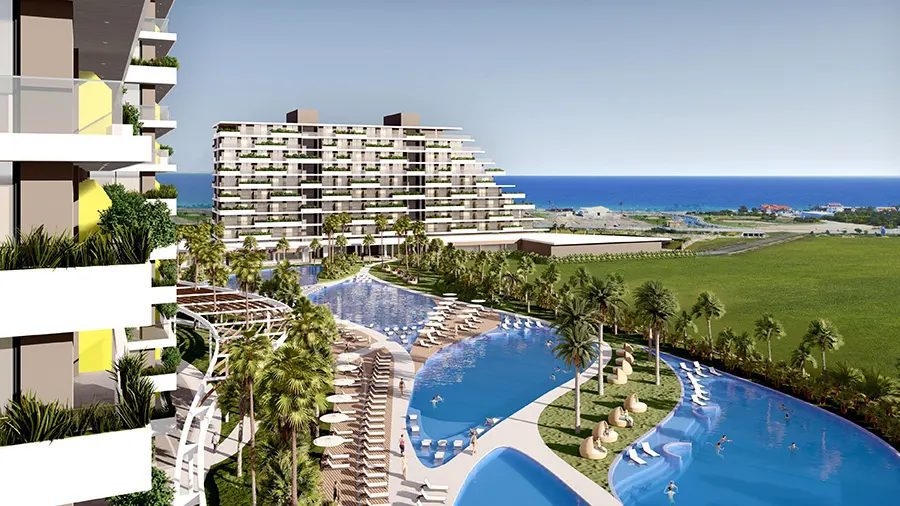 Grand Sapphire Phase 4 Iskele render of a pool and apartment blocks facing the sea