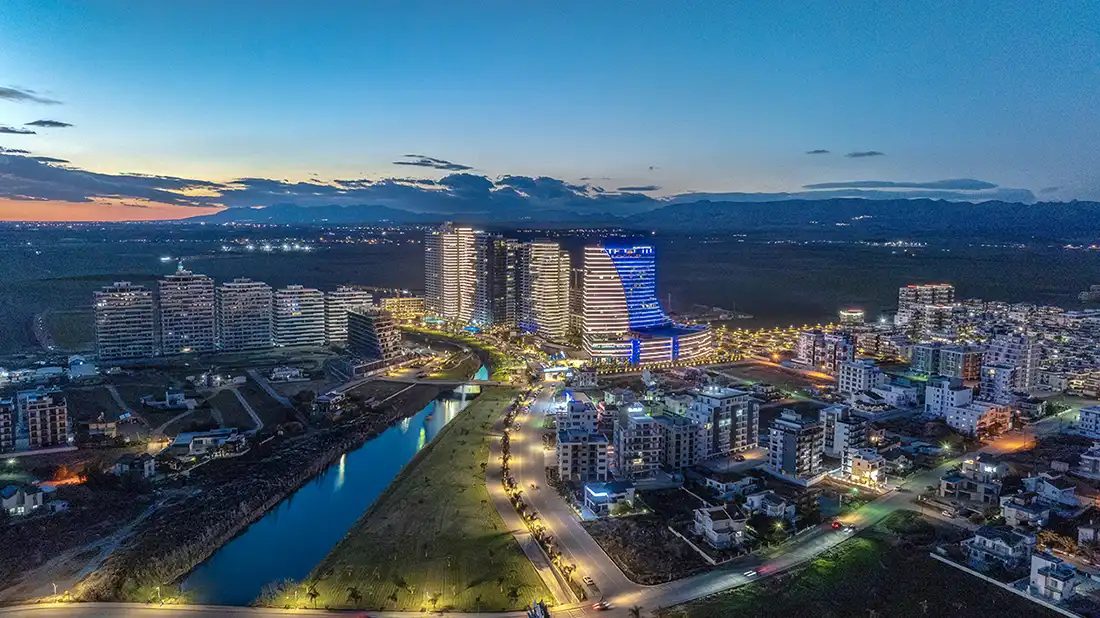 Aerial dusk view of apartment blocks along a canal