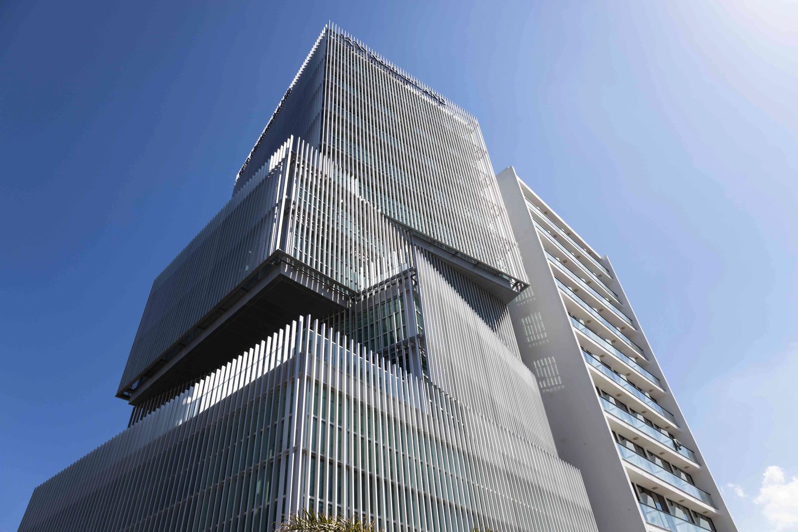 Upward view of the stepped glass facade of the tower