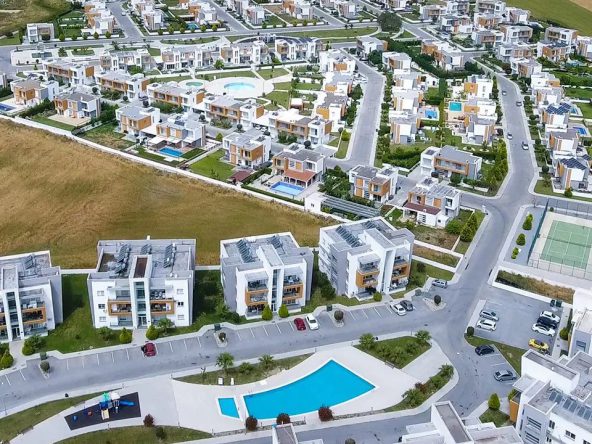 Aerial view of the Sakli Kent villa and apartment estate with pool and tennis court