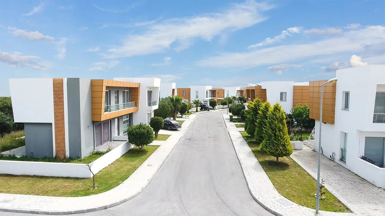 Residential street in Sakli Kent lined with modern villas and landscaping