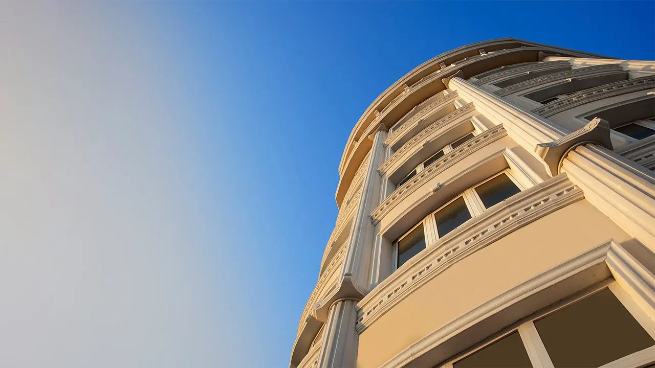 Rounded corner of the building with classical window surrounds