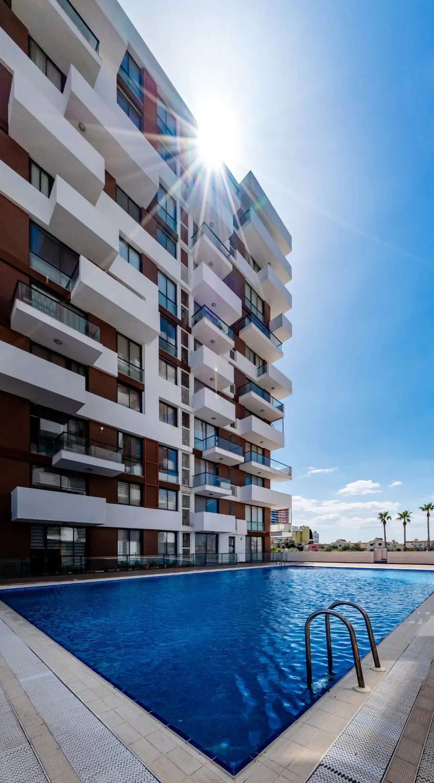Outdoor swimming pool beside the residential tower