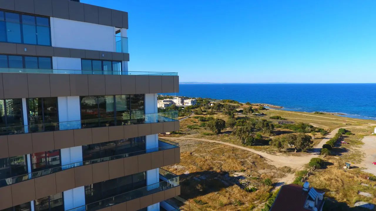 Viapark balconies in the foreground with the sea and coastal land beyond
