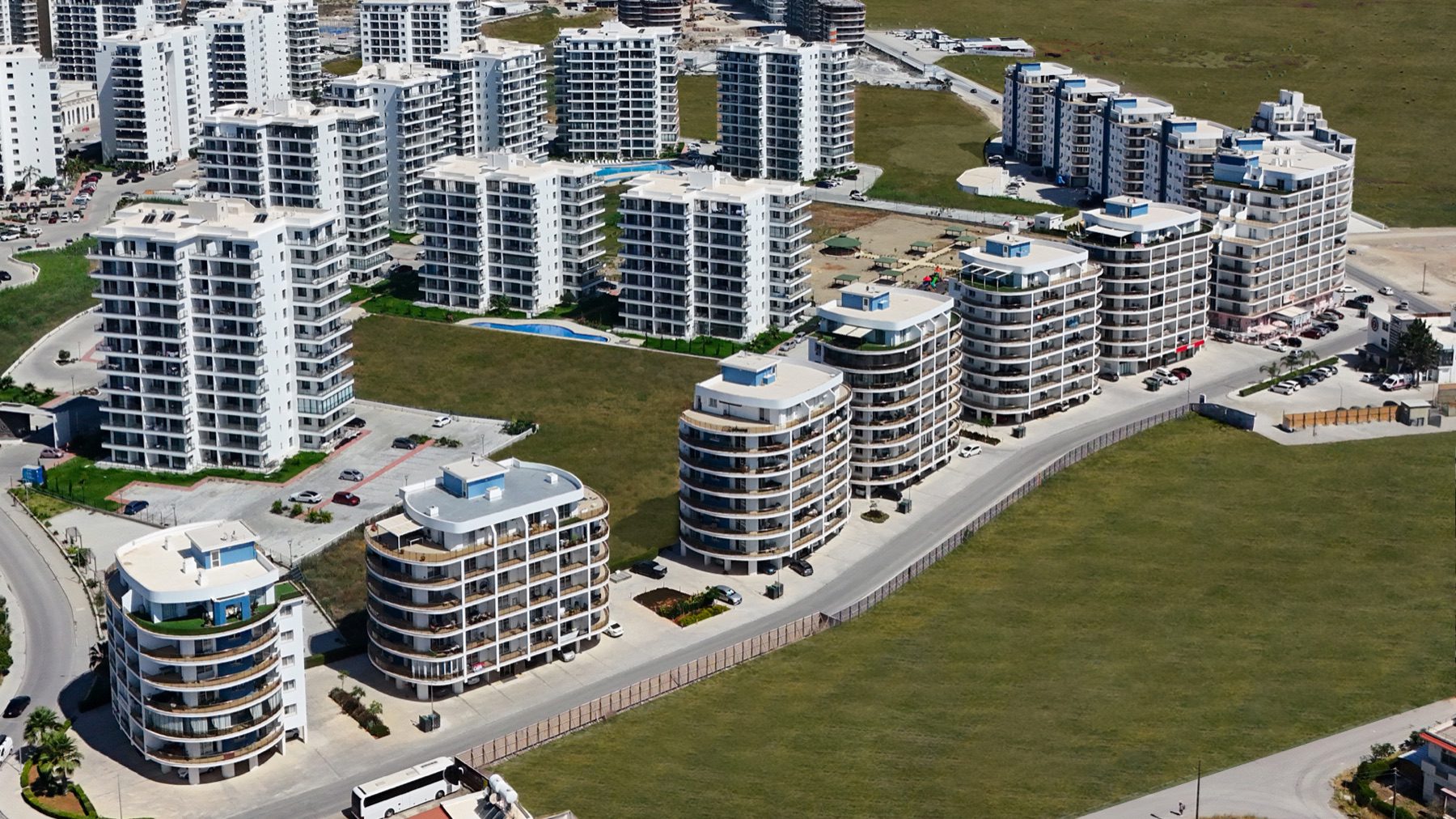 aerial view of Park Residence blocks with white balconies and green land