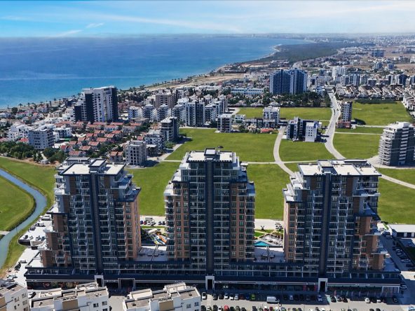 Aerial view of the three Riverside Life Residence towers beside the sea