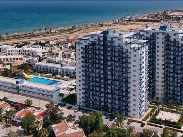 Aerial view of the Royal Life Residence towers, pool and coastline