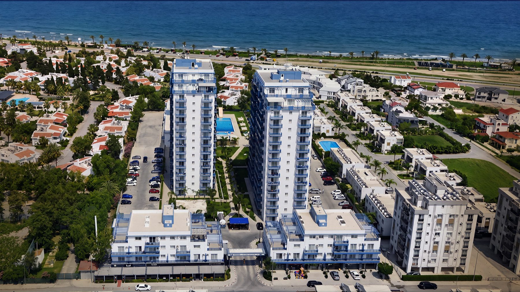 Aerial view of Royal Life Residence towers and surrounding area by the sea