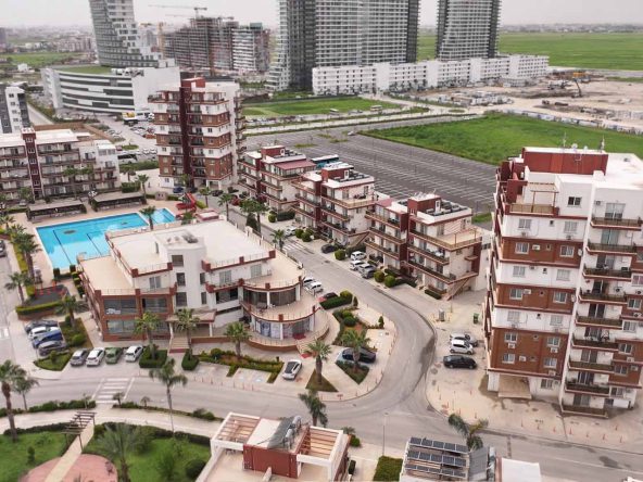 Aerial view of Royal Sun Residence apartment tower and pool area