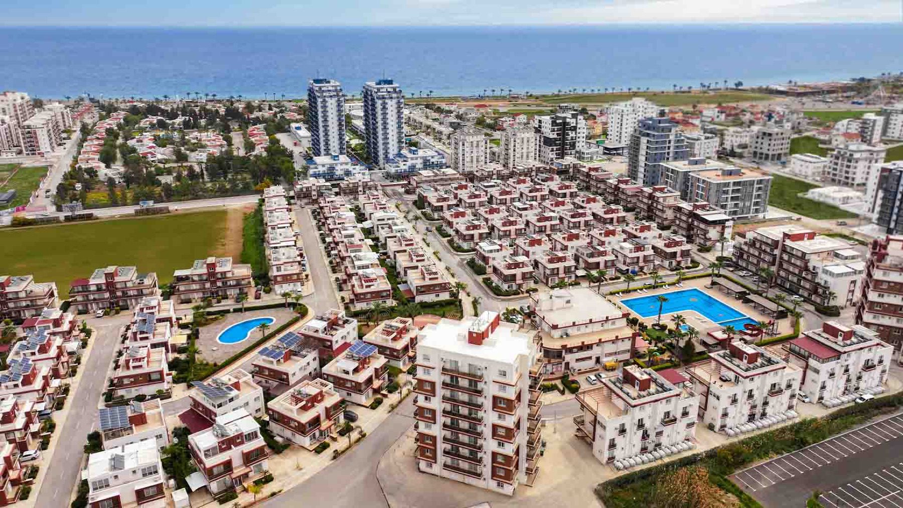 Aerial view of Royal Sun Residence complex with sea on the horizon