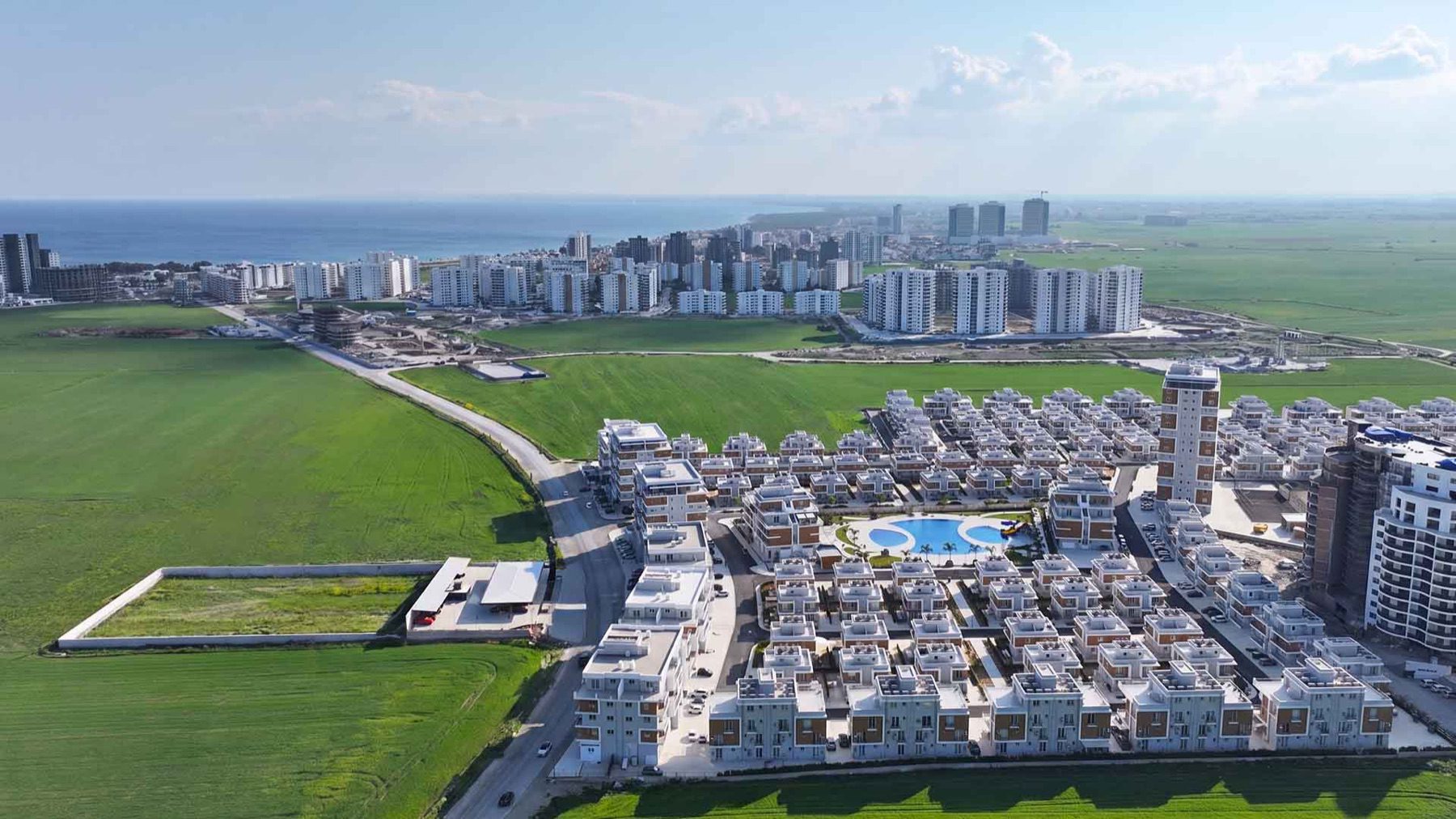 Aerial view of Royal Sun Elite Residence with sea on the horizon