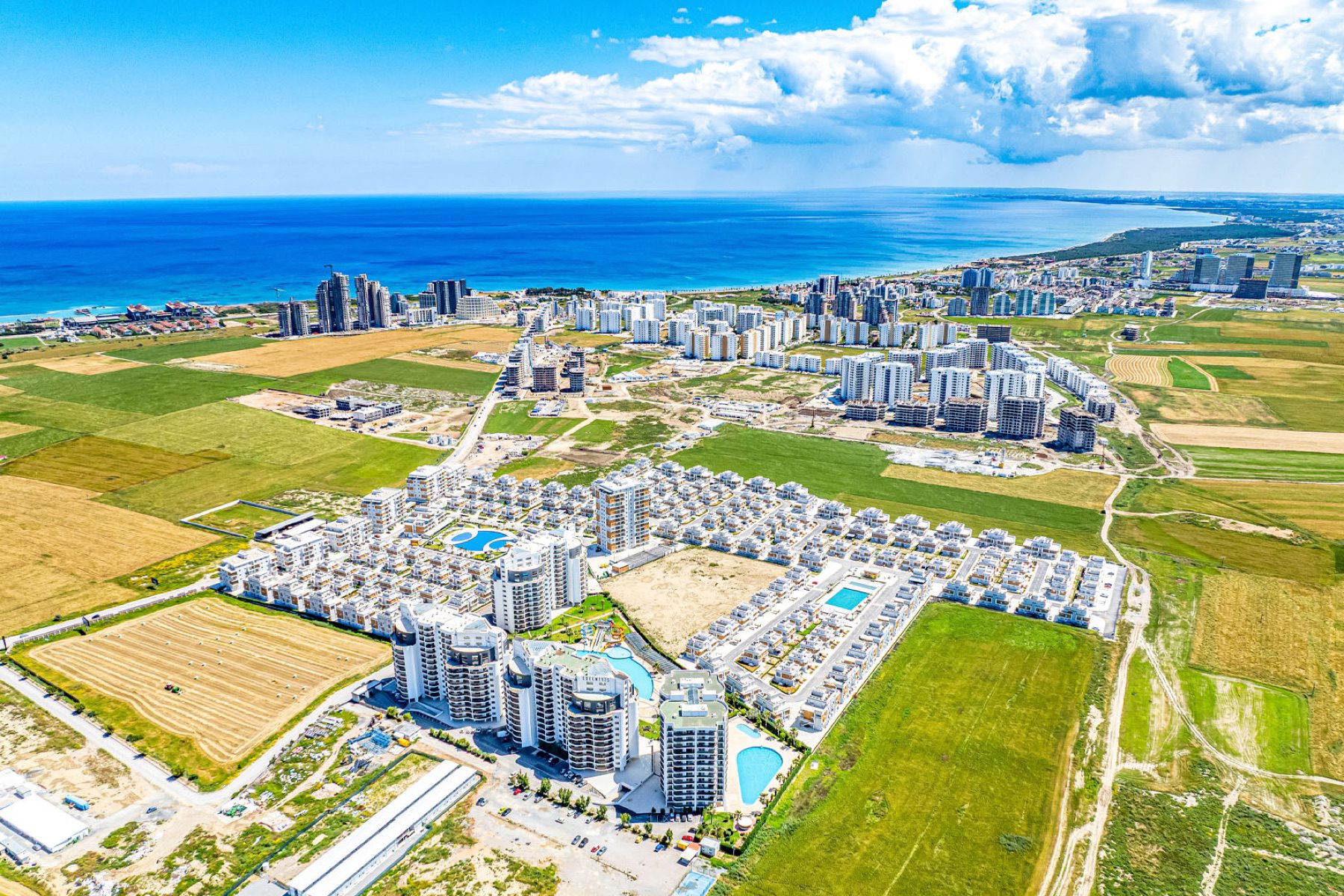 Wide aerial view of Royal Sun Elite Residence and the coast