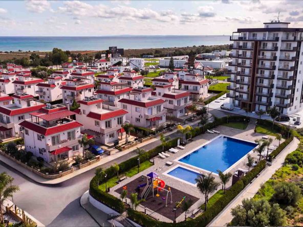 Aerial view of Sea Pearl Residence villas, apartment tower and pool near the coast