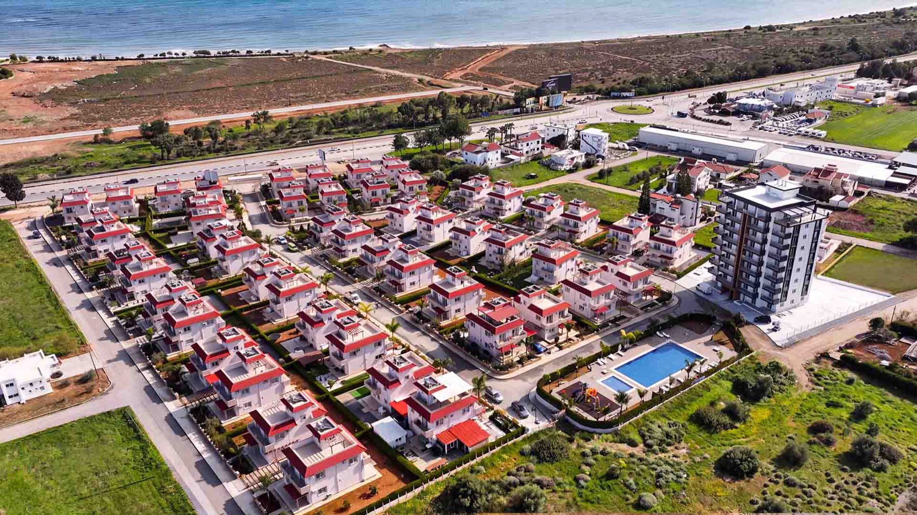 Aerial view of Sea Pearl Residence villas, tower and swimming pool